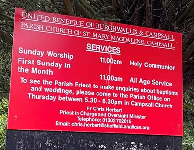 A sign in a park
Description automatically generated